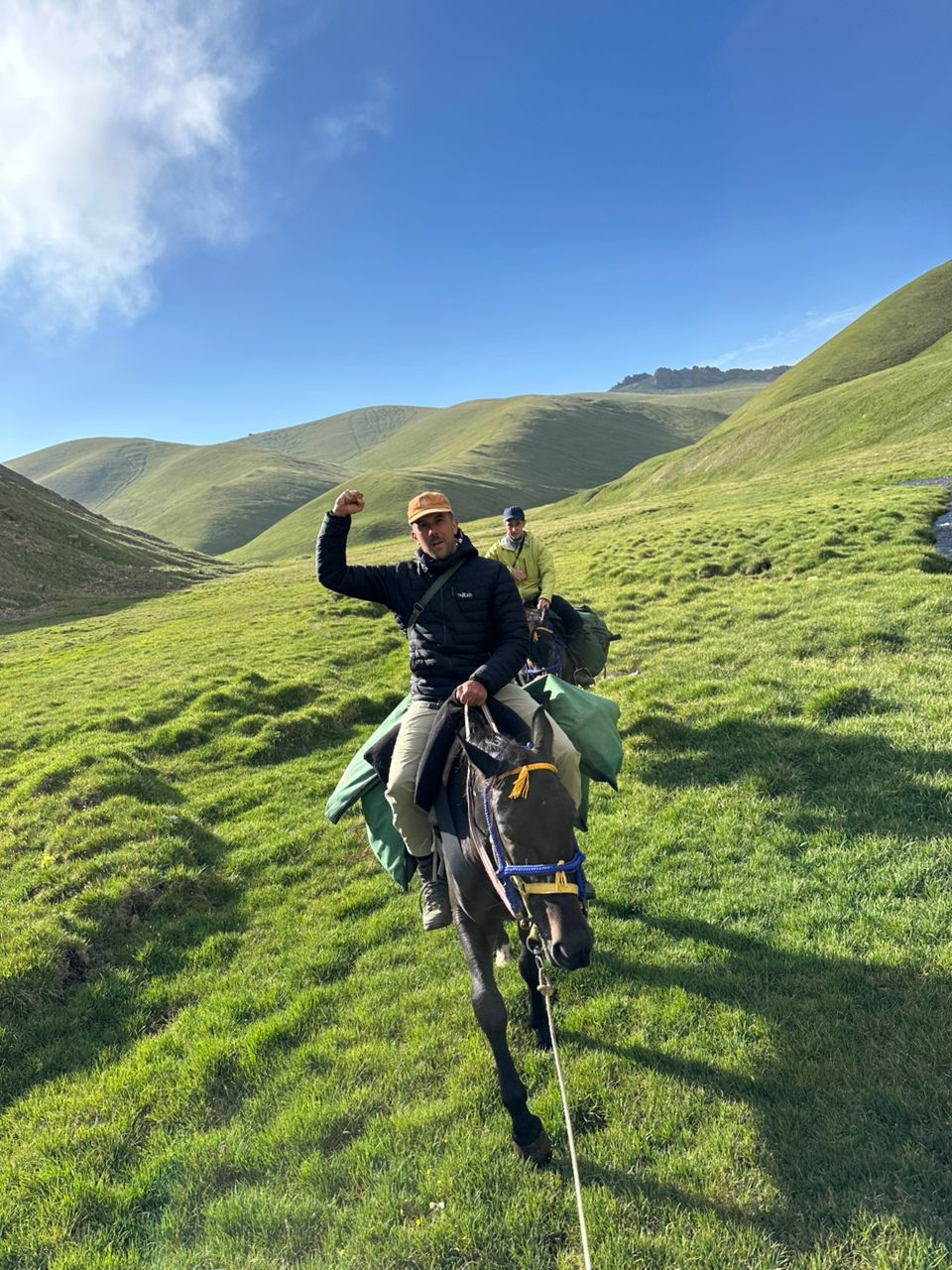 Guide celebrating in the green hills